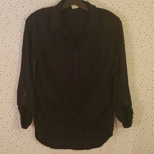 Mid-level black blouse with twist tied front